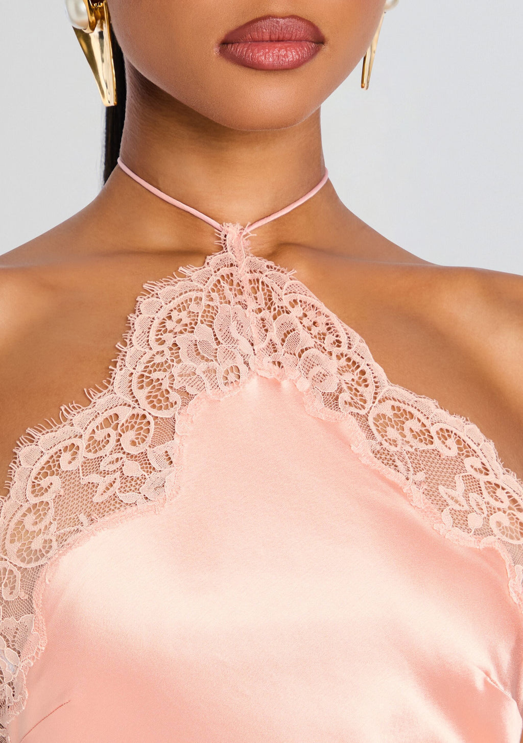 Close up of the Everly Dress neckline showing blush satin fabric and delicate lace halter
