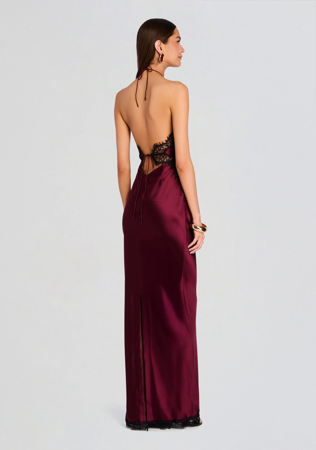 Back view of burgundy satin Everly Dress with black lace mid back and halter neck ties
