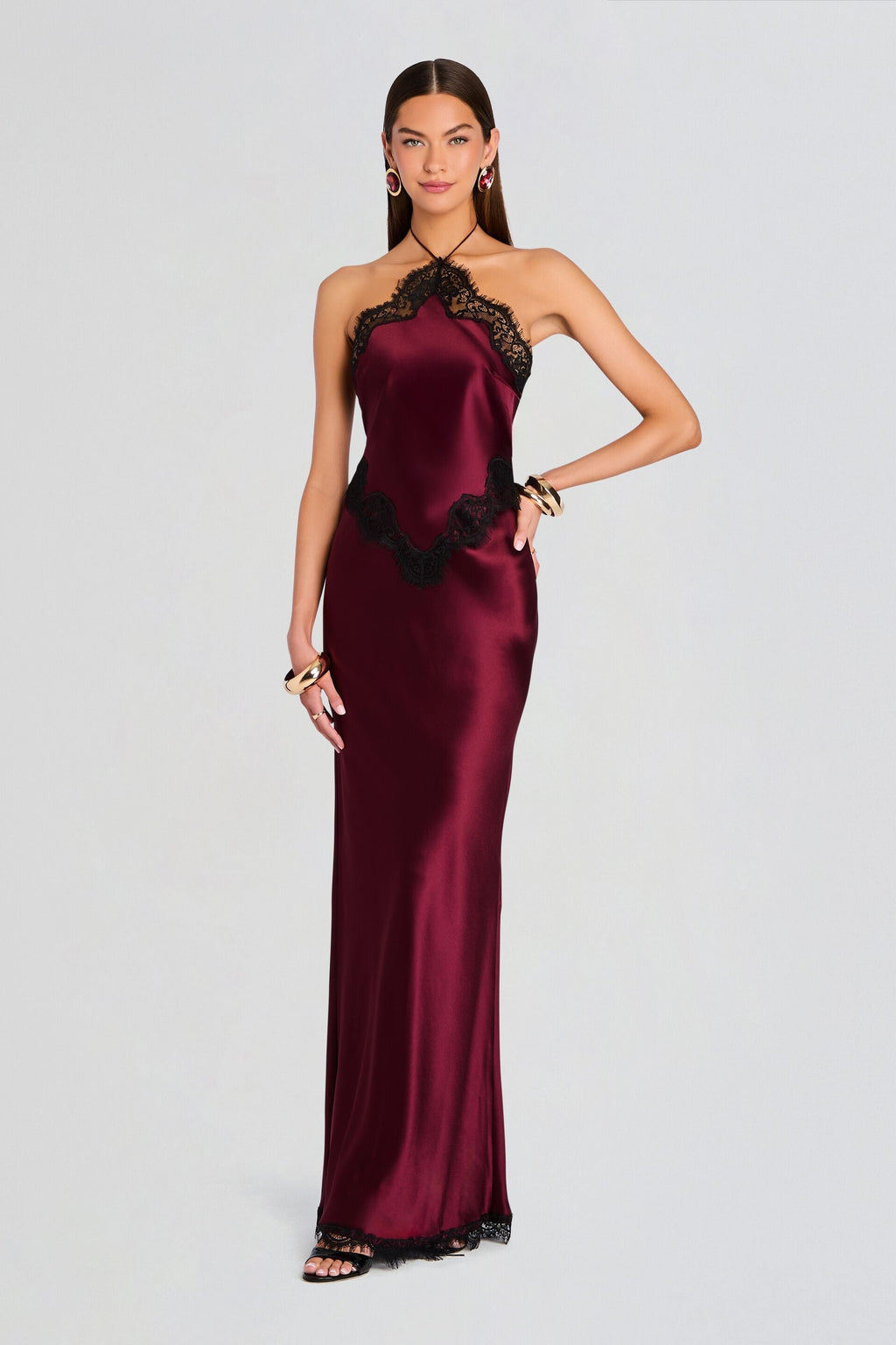 Burgundy satin floor-length dress with a black lace halter neckline and waistline lace accents