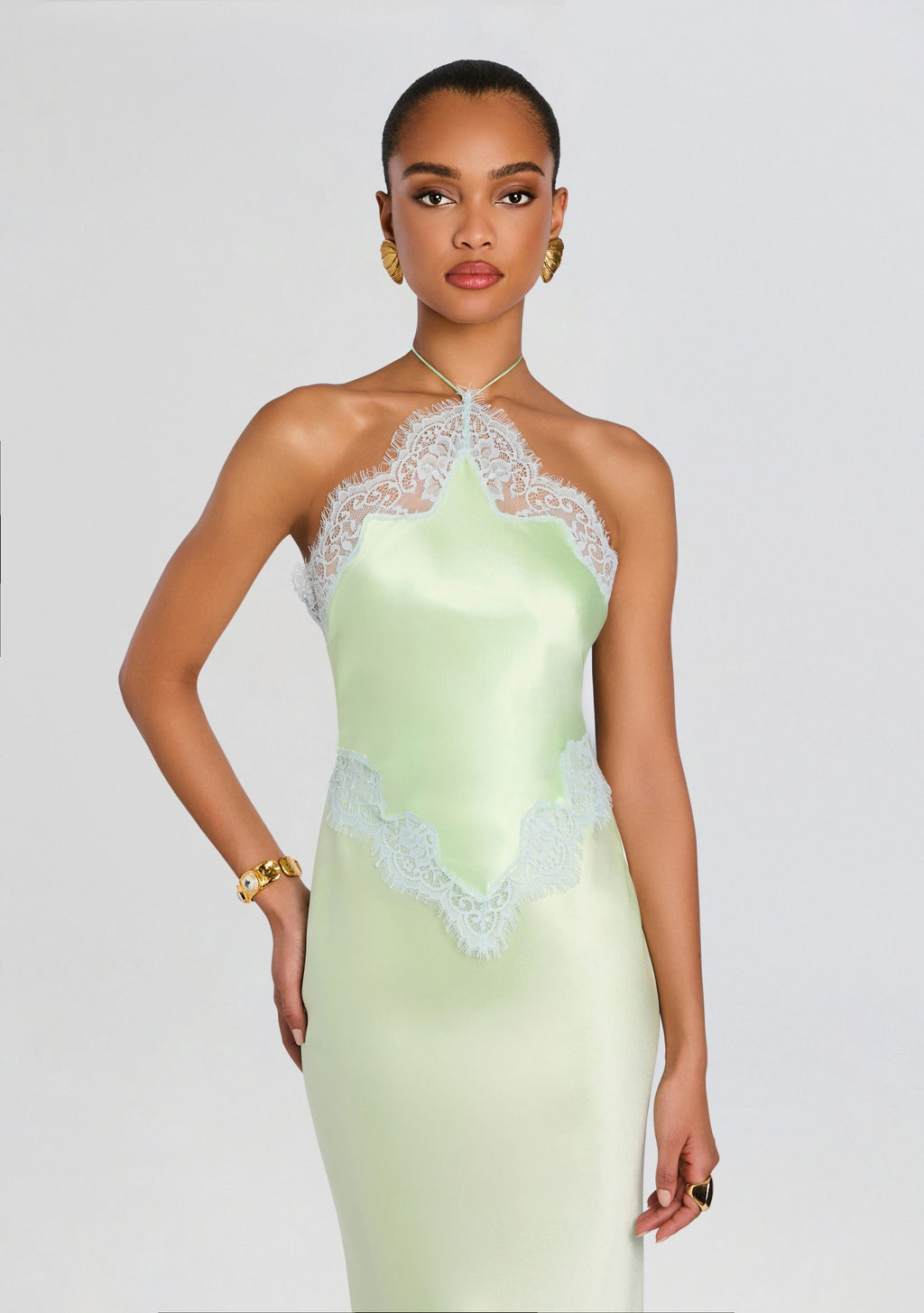 Everly Dress mint satin with lace halter neckline and waist trim on a model
