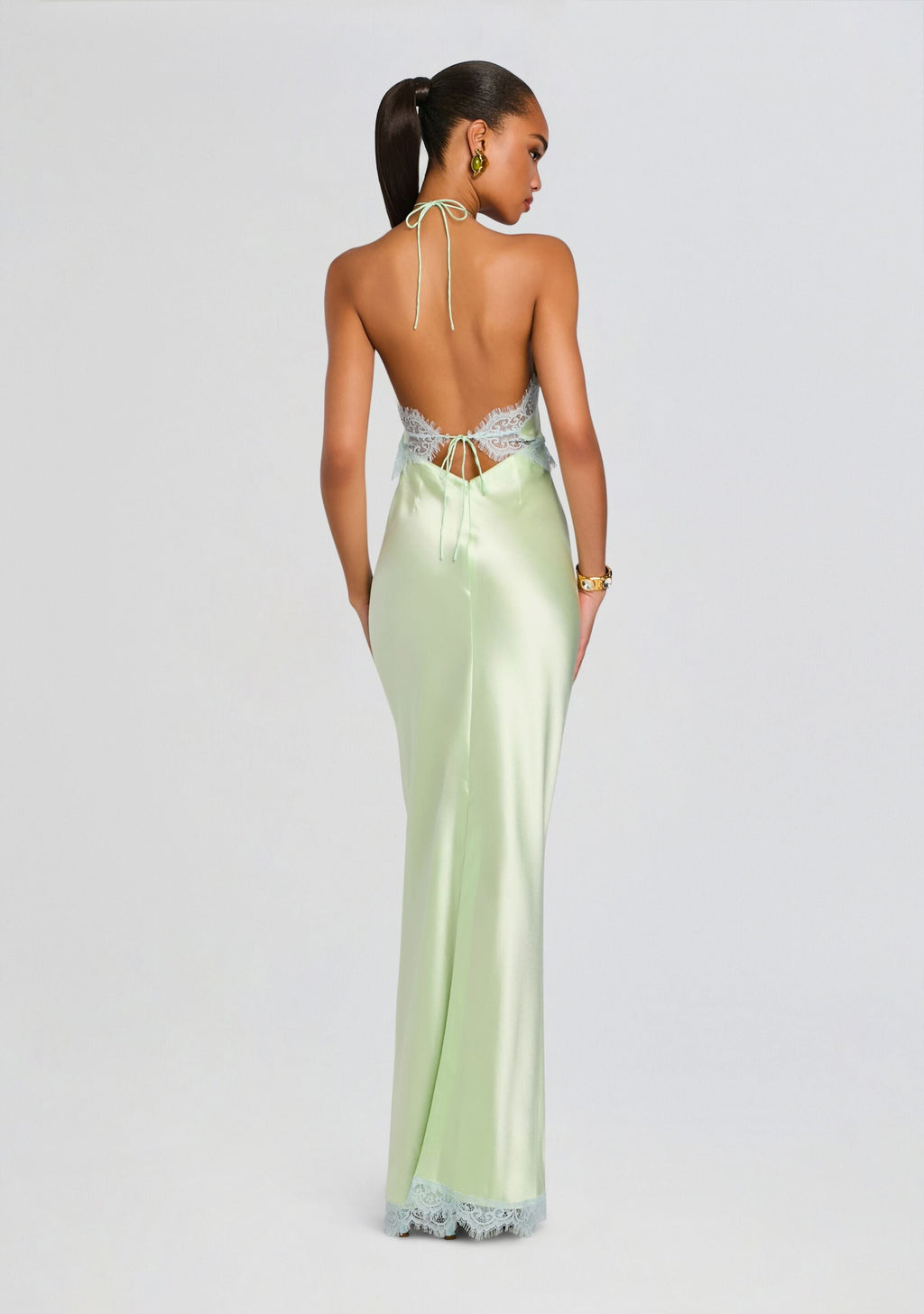 Back view of Everly Dress in mint satin with a lace back panel and neck ties