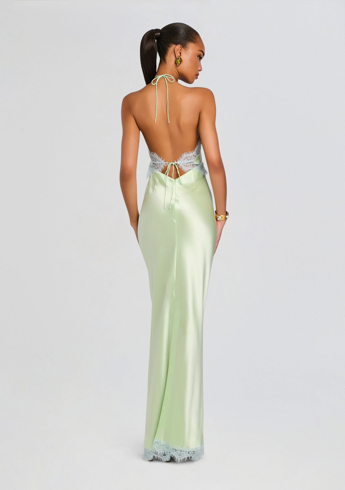 Back view of Everly Dress in mint satin with a lace back panel and neck ties